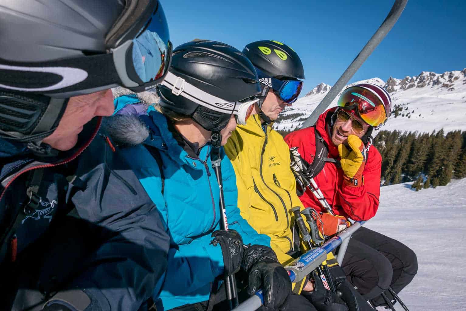 family chatting on chair lift